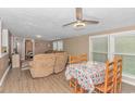 Bright dining area with seating for four and view of living room at 6001- Mh182 S Kings Hwy., Myrtle Beach, SC 29575