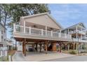 Elevated two-story home with spacious deck and covered parking at 6001-1886 S Kings Hwy., Myrtle Beach, SC 29575