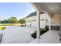 Three-car garage with covered walkway and stone accents at 1017 Muscovy Pl., Conway, SC 29526