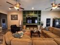 Open living room featuring a built-in entertainment center and fireplace at 225 Coachman Dr., Pawleys Island, SC 29585