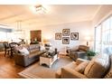 Bright living room with leather sofas and adjacent dining area at 4161 Hibiscus Dr. # 203, Little River, SC 29566