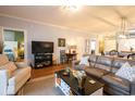 Open concept living space with hardwood floors and comfortable seating at 4161 Hibiscus Dr. # 203, Little River, SC 29566