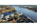 Aerial view of waterfront community with lighthouse and boats at 4530 Lighthouse Dr. # 31-C, Little River, SC 29566