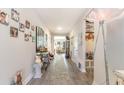 Long hallway with hardwood floors, wall art, and decorative accents at 5037 Sassari St., Myrtle Beach, SC 29579
