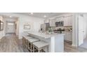 Modern kitchen with granite countertops and gray cabinets at 519 Firouz Dr, Longs, SC 29568