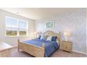 Bedroom with a light-colored wooden bed frame and blue bedding at 531 Firouz Dr, Longs, SC 29568