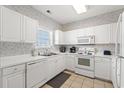 White kitchen with appliances and tile floor at 5801 Oyster Catcher Dr. # 533, North Myrtle Beach, SC 29582