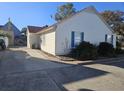 Side view of the house, showing a satellite dish at 927 Edge Dr., North Myrtle Beach, SC 29582