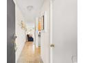 View down condo hallway, with tiled floors and access to rooms at 9501 Shore Dr. # D-235, Myrtle Beach, SC 29572