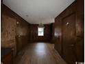 Simple dining room with wood paneling and hardwood floors at 333 Whites Creek Rd., Georgetown, SC 29440