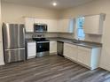 Modern kitchen with stainless steel appliances and granite countertops at 528 Tillage Ct., Conway, SC 29526