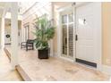 Bright hallway with tile floors, potted plant, and access to individual units at 815 Front St. # 2H, Georgetown, SC 29440