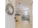 Bright entryway with decorative wreath, leading to kitchen and dining area at 901 West Port Dr. # 2118, North Myrtle Beach, SC 29582