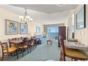 Spacious living room with ocean view, dining area, and seating at 2501 S Ocean Blvd. # 1111, Myrtle Beach, SC 29577