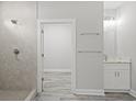 Bathroom with a walk-in shower, tiled floors and a vanity with granite countertop at 5575 Dinkler Ave., Loris, SC 29569