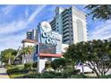 Oceanfront resort entrance, Compass Cove, with signage and landscaping at 2301 S Ocean Blvd. # Ph22, Myrtle Beach, SC 29577