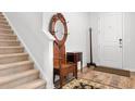 Entryway with hardwood floors, antique furniture, and carpeted stairs at 4739 Cloisters Ln., Myrtle Beach, SC 29577