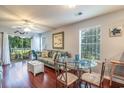 Spacious living room with hardwood floors and access to a balcony at 598 Blue Stem Dr. # 52D, Pawleys Island, SC 29585
