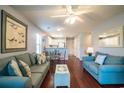 Open living area with hardwood floors, comfortable seating, and dining area at 598 Blue Stem Dr. # 52D, Pawleys Island, SC 29585