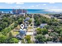Aerial view showing home's location near the beach and other houses at 606 29Th Ave. S, North Myrtle Beach, SC 29582