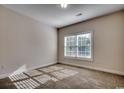 Bright bedroom with carpet flooring and a large window with blinds at 100 Barons Bluff Dr., Conway, SC 29526