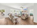 Bright living room with hardwood floors, fireplace, and comfortable seating at 1054 Graybill Lane, North Myrtle Beach, SC 29582