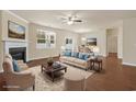 Spacious living room with hardwood floors, a fireplace, and views to a dining area at 2813 Mcdougall Dr., Conway, SC 29526