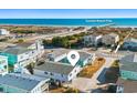 Aerial view showing beach house location near the ocean at 431 28Th St. S, Sunset Beach, NC 28468