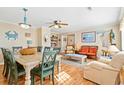 Bright dining room with light wood table and green chairs at 431 28Th St. S, Sunset Beach, NC 28468