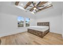 Bright bedroom with hardwood floors and a rustic wooden bed frame at 6703 Ocean Breeze Loop, Myrtle Beach, SC 29577