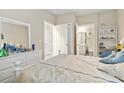 Bedroom with white dresser and access to bathroom at 4519 N Plantation Dr. # X-9, Little River, SC 29566
