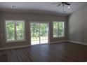 Bright living room with hardwood floors, multiple windows and sliding glass doors at Tbd 15 Mineral Springs Rd., Conway, SC 29527