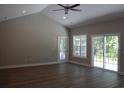 Spacious living room with hardwood floors, vaulted ceiling and sliding glass doors at Tbd 15 Mineral Springs Rd., Conway, SC 29527