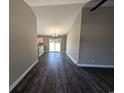 Spacious living room with dark laminate floors and neutral walls at Tbd20 Casey Dr., Nichols, SC 29581