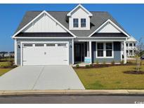 Two-story home with gray siding and white trim at 239 Bluestem Loop, Little River, SC 29566