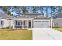 Two-story house with a two-car garage, stone accents, and a front porch at 538 Beckham Ct., Murrells Inlet, SC 29576