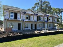 New construction townhouses with gray siding and balconies at 801 Rebecca Ln. # 7B, Myrtle Beach, SC 29577