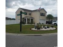 Two-story house with landscaped yard and attached garage at 219 Oak Leaf Dr., Longs, SC 29568