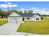 Single-story house with a white exterior and a gray roof at 1609 Ackerrose Dr., Conway, SC 29527