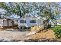 Single-story home with ramp access and small front yard at 6001 - Mh197 South Kings Hwy., Myrtle Beach, SC 29575