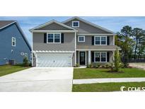 Two-story house with gray siding and white trim at 263 Lassoed Circle, Murrells Inlet, SC 29576