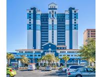 Oceanfront Paradise Resort building exterior, showcasing its blue and white design and ample parking at 2201 S Ocean Blvd. # 1705, Myrtle Beach, SC 29577