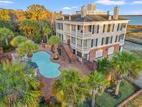 Luxury home with pool and brick patio; waterfront property at 101 Greenwich Dr., Georgetown, SC 29440