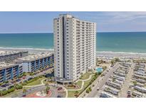 Oceanfront highrise building with beach and parking area at 5905 S Kings Highway # 1117, Myrtle Beach, SC 29575