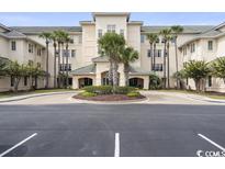 Attractive building exterior with palm trees and ample parking at 2180 Waterview Dr. # 837, North Myrtle Beach, SC 29582