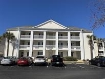 Three-story building exterior with columns and balconies at 5020 Windsor Green Way # 103, Myrtle Beach, SC 29579