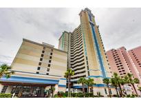 Oceanfront high-rise building with parking and palm trees at 2504 Ocean Blvd. # 1134, Myrtle Beach, SC 29577