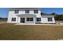 Two-story home with white siding, black windows, and a covered porch at Tbd 9 Privetts Rd., Conway, SC 29526