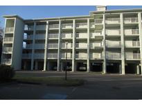 Three-story building with parking and balconies at 14290 Ocean Hwy. # 103, Pawleys Island, SC 29585