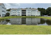 Apartment building with pond view in front at 2273 Huntingdon Dr. # J, Surfside Beach, SC 29575